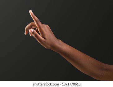 Human hand reaching out with black background