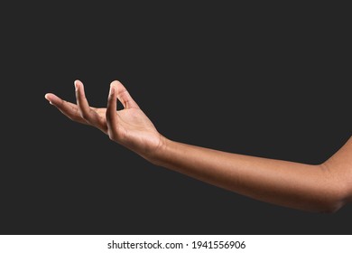 Human Hand Reaching Out On Black Background