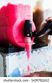 Human Hand Serving Slushy Drink From Slushy  Machine