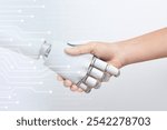 Human hand shaking robot hand, symbolizing human-robot collaboration and technology. Futuristic and innovative. Connection between robot and human hands. Robotic and AI technology with human