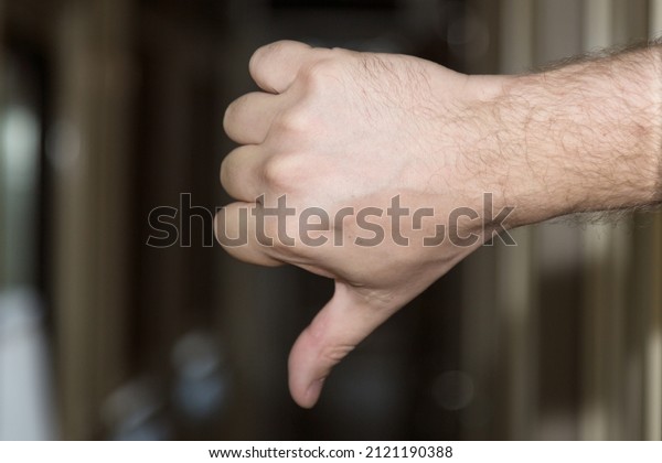 The human hand showing all bad down your\
finger down in the corridor of the\
train.