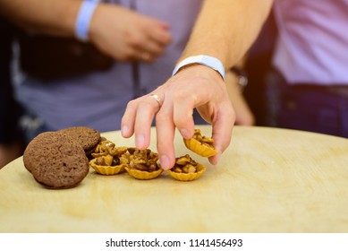 Human hand taking cookie