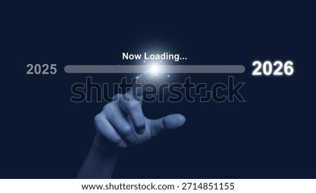 Human hand touch progress bar labeled now loading from 2025 to 2026 on dark background, symbolizing future transition, digital progress, new year change, innovation, technology advancement concept.