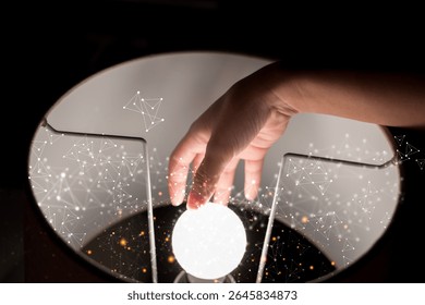 A human hand touching a glowing orb with abstract digital network particles floating around. Futuristic concept of connection, light, innovation, artificial intelligence, and human interaction.
