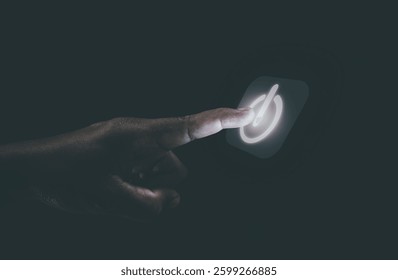 Human hand touching the power button, the concept of getting started