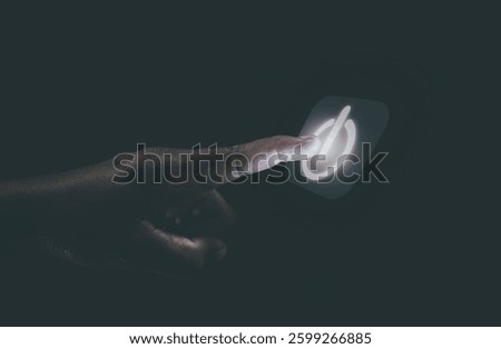 Human hand touching the power button, the concept of getting started