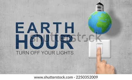 Human hand turning off the switch. Earth Hour Concept