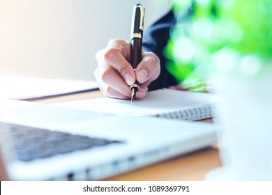 person writing on paper
