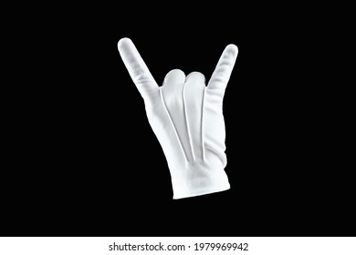 Human Hand, Hand In White Glove Isolated On Black Background, Showing Rock And Roll Gesture. Human Gesture Concept