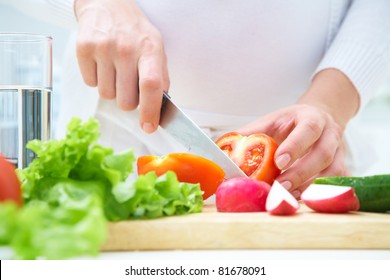 Human Hands  Cooking Vegetables Salad In Kitchen