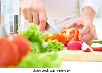 Human Hands  Cooking Vegetables Salad In Kitchen