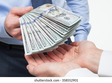 Human hands exchanging money on white background