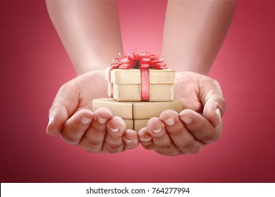Happy Boxing Day Messages, Wishes, Quotes, And Images 31 Human hands holding gift for boxing day. Boxing Day Concept