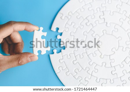 Human hands holding jigsaw  with word problem & solution.  symbol of association and connection. business strategy.