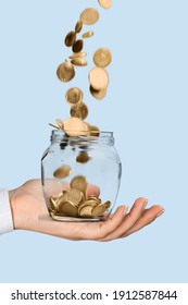 Human Hands Holding Money Jar With Coins