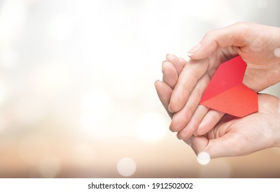 Human Hands Holding Red Heart, Health Care, Love And Support,