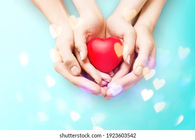 Human Hands Holding Red Toy Heart. Valentine's Day