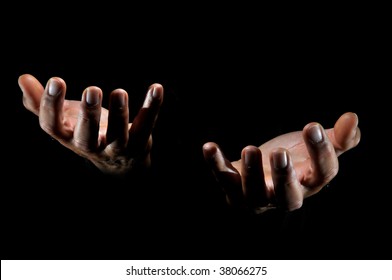 Human hands isolated in a black background - Shutterstock ID 38066275