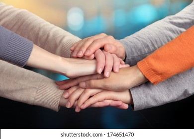 Human hands on bright background