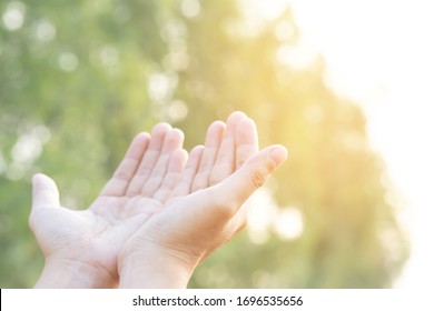 Human hands open palm up worship Praying hands with faith and belief in God of an appeal to the sky. Concept Religion and spirituality with believe Power of hope or love and devotion.