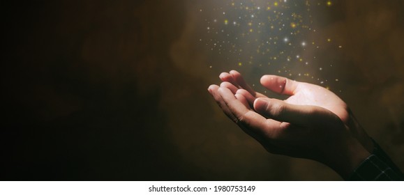 Human hands open palm up worship with faith in religion and belief in God on blessing background.Christian Religion concept background. 