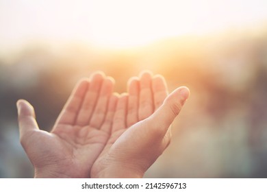 Human hands open palm up worship Praying with faith and belief in God of an appeal to the sky. Concept Religion and spirituality with believe Power of hope or love and devotion. filler tone vintage. - Shutterstock ID 2142596713
