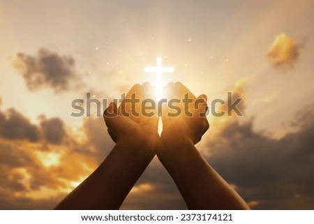 Human hands open palms up to worship hope with the Cross is a symbol of Christianity.Concept Religion and spirituality with believe Power of hope or love and devotion. fighting and victory for god. 