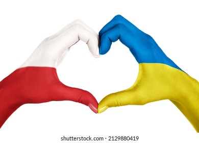 Human hands, painted with Poland and Ukraine flags,  forming heart shape isolated on white background - Shutterstock ID 2129880419