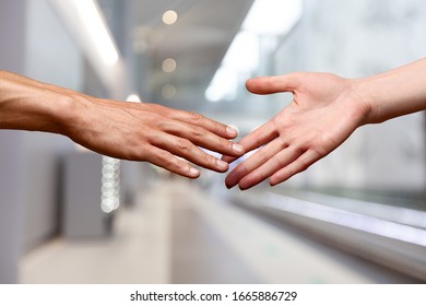 Human Hands Pulling One To Another