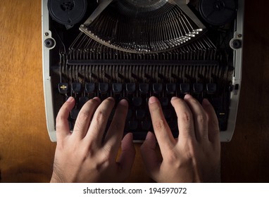 Human hands typing with typewriter. 