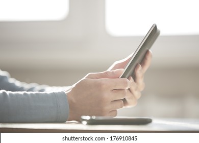 Human Hands Using Tablet Computer At Home