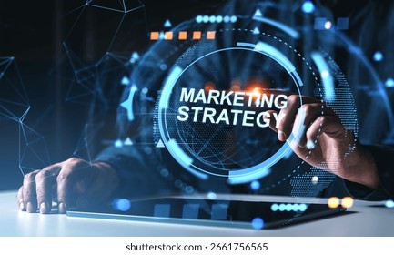 Human hands using tablet with glowing marketing strategy interface in futuristic graphic style on dark abstract background, concept of strategy planning