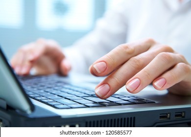 Human hands working on laptop on office background - Shutterstock ID 120585577