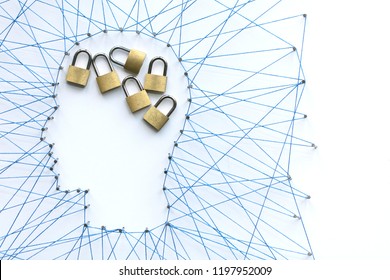 Human head shape made from a large grid of pins connected with string. Communication technology and mental health concept