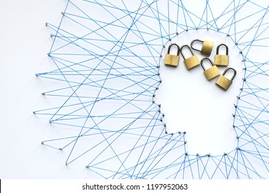 Human head shape made from a large grid of pins connected with string. Communication technology and mental health concept
