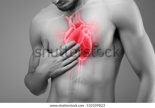 Human heart, man\
holds his hand on his\
heart.
