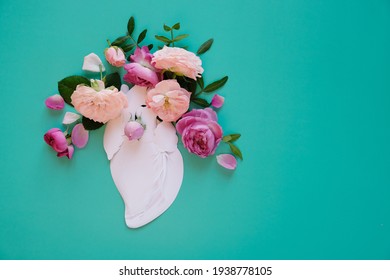 Human Heart Organ Concept With Flowers As A Circulatory Anatomy Made Of Paper As A Medical Health Care Symbol Of An Inner Cardiovascular Body Part.