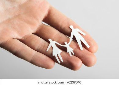 Human Holding Little Paper Cutout Family, Happy Family Concept