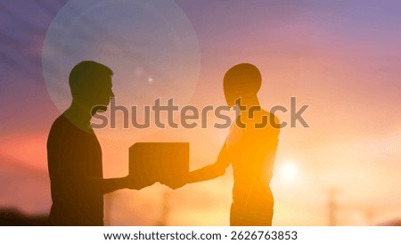 A human and a humanoid robot exchange a package during sunset, symbolizing future cooperation between humans and artificial intelligence in logistics and service industries. copy space for text