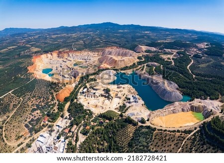 Human impact on the natural environment. Aerial view of an open-mine in Greece. High quality photo