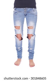 Human Legs In The Ripped Jeans