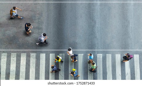 Human Life In Social Distance. Aerial Top View With Blur Man With Smartphone Walking Converse With Busy City Crowd Move To Pedestrian Crosswalk