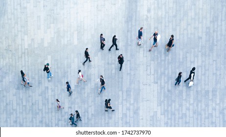 Human Life In Social Distance. Top View Of Blur People Are Walking In Public Space On Concrete Pavement Landscape. Concept In Aerial View Of Man And Woman Family With Empty Space.