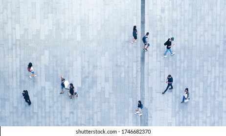 Human Life In Social Distance. Top View Of Motion Blur People Are Walking In Public Space On Concrete Pavement Landscape. Concept In Aerial View Of Man And Woman Family With Empty Space.