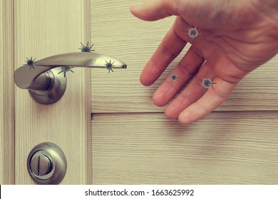human life through which germs and viruses spread, door handle in an apartment in a room or house with hand and finger, the concept of germs sitting on the door handle
