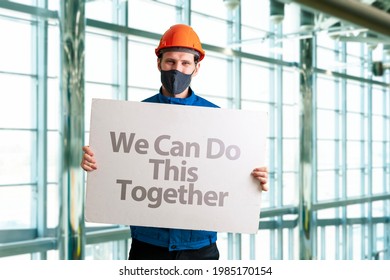 Human In Mask Holding A White Frame Banner With Text 