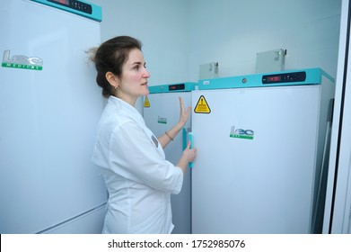 Human Milk Bank Laboratory. Lab Assistant Opening Freezer Where Containers With Breast Milk Stored. April 13, 2019. Kiev, Ukraine