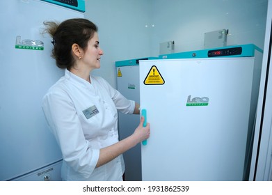 Human Milk Bank Laboratory. Lab Assistant Opening Freezer Where Containers With Breast Milk Stored. April 13, 2019. Kiev, Ukraine