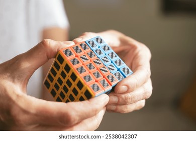 Human mind and hands are solving alternative Rubik's puzzle cube