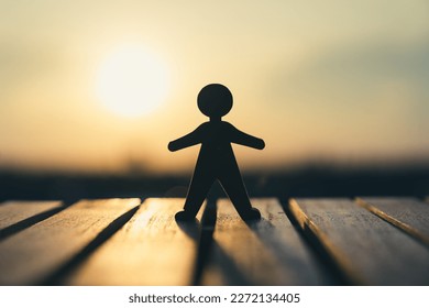 The human model stood on the balcony outside the window looking at the city in the bright sun. Business idea solution and hope.
